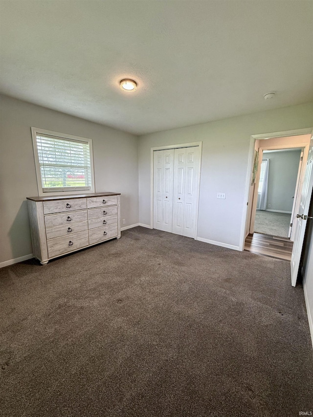 7540 S US-27 Hwy, Portland, IN 47371 - unfurnished bedroom featuring carpet, baseboards, and a closet