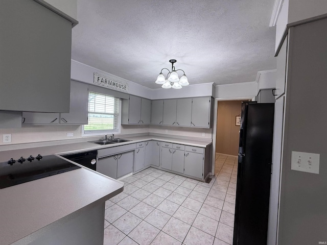 7540 S US-27 Hwy, Portland, IN 47371 - kitchen with black appliances, gray cabinets, a chandelier, a sink, and light tile patterned floors