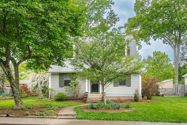 822 S Stull Ave, Bloomington, IN 47401 - view of property hidden behind natural elements featuring a chimney and roof with shingles