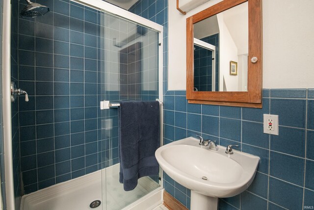 822 S Stull Ave, Bloomington, IN 47401 - full bath featuring a shower stall, tile walls, a sink, and a wainscoted wall
