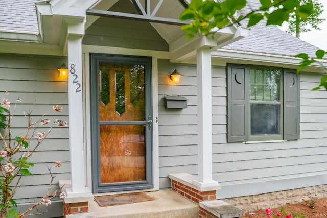822 S Stull Ave, Bloomington, IN 47401 - property entrance with a shingled roof and a porch