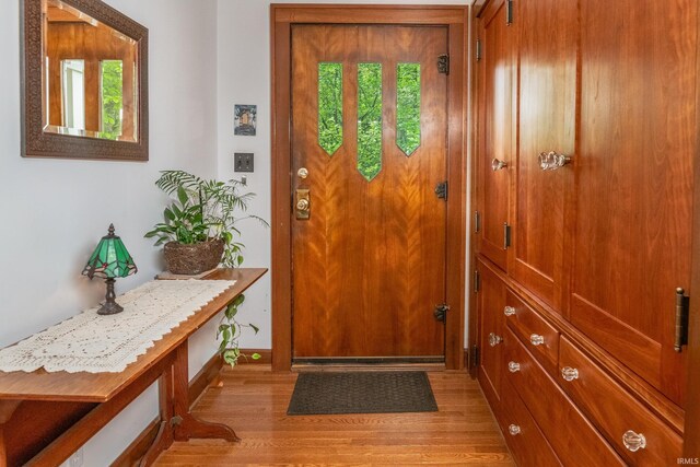 822 S Stull Ave, Bloomington, IN 47401 - doorway to outside featuring light wood-style flooring and baseboards