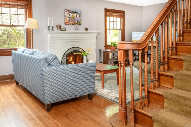 822 S Stull Ave, Bloomington, IN 47401 - living room featuring wood finished floors, stairs, and healthy amount of natural light