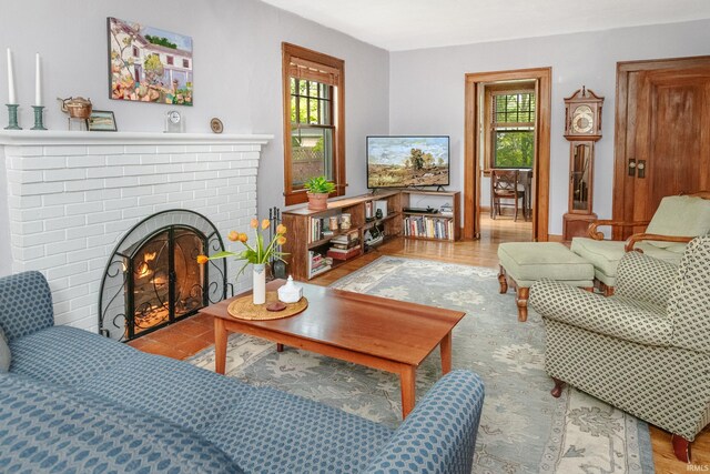 822 S Stull Ave, Bloomington, IN 47401 - living area featuring a brick fireplace and wood finished floors