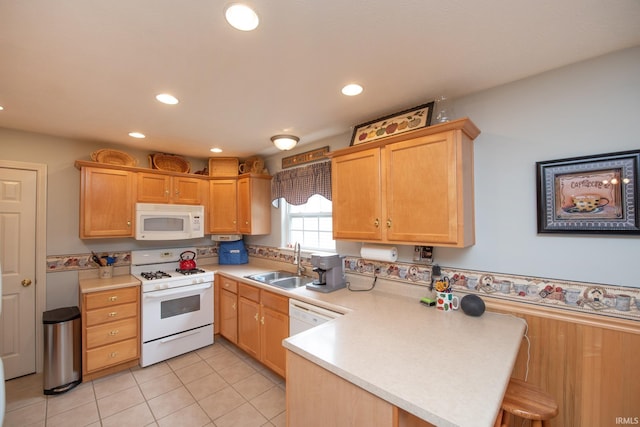 1876 Halyard Ct, West Lafayette, IN 47906 - kitchen with white appliances, a sink, a peninsula, light countertops, and recessed lighting