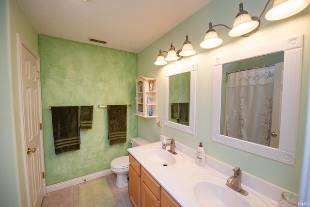 1876 Halyard Ct, West Lafayette, IN 47906 - full bathroom featuring toilet, double vanity, tile patterned flooring, baseboards, and a shower with shower curtain