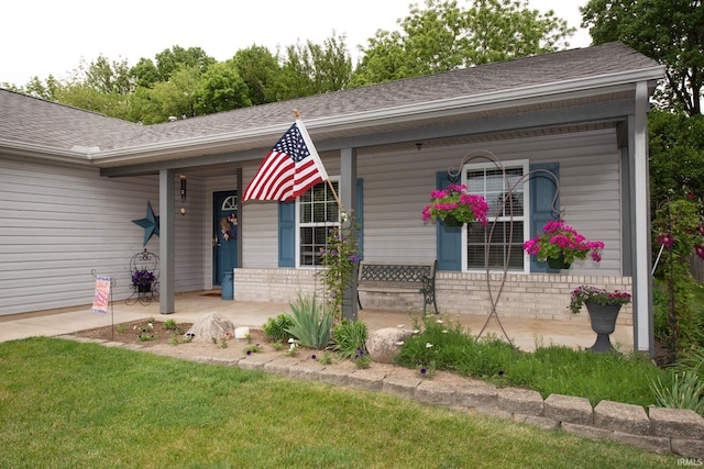 1876 Halyard Ct, West Lafayette, IN 47906 - ranch-style home with a porch, brick siding, a shingled roof, and a front yard