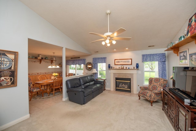 1876 Halyard Ct, West Lafayette, IN 47906 - living area with a tiled fireplace, a ceiling fan, plenty of natural light, carpet, and lofted ceiling