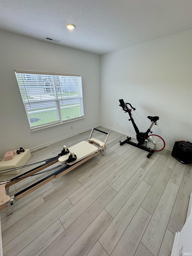 2135 Upland Ridge Way, Kokomo, IN 46902 - exercise area with wood finished floors, baseboards, and recessed lighting