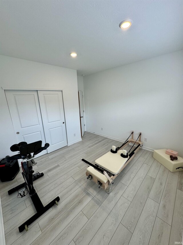 2135 Upland Ridge Way, Kokomo, IN 46902 - workout room featuring light wood finished floors, baseboards, and recessed lighting