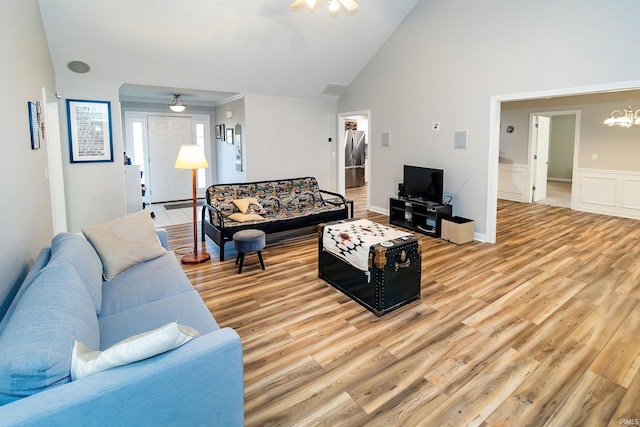 105 Temple Dr, Newburgh, IN 47630 - living room featuring a chandelier, light wood finished floors, a ceiling fan, and high vaulted ceiling