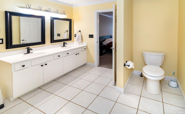 105 Temple Dr, Newburgh, IN 47630 - ensuite bathroom featuring ornamental molding, double vanity, toilet, tile patterned floors, and baseboards