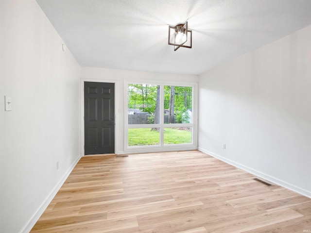 2834 Inwood Dr, Fort Wayne, IN 46815 - foyer with baseboards and light wood finished floors