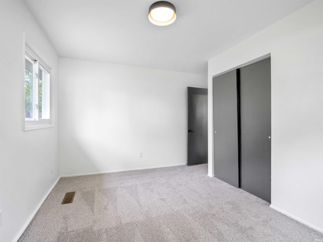 2834 Inwood Dr, Fort Wayne, IN 46815 - unfurnished bedroom with carpet flooring, a closet, and baseboards