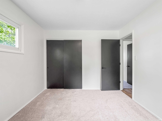2834 Inwood Dr, Fort Wayne, IN 46815 - unfurnished bedroom with carpet floors and a closet