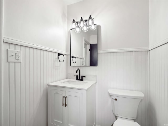 2834 Inwood Dr, Fort Wayne, IN 46815 - bathroom featuring wainscoting, vanity, and toilet