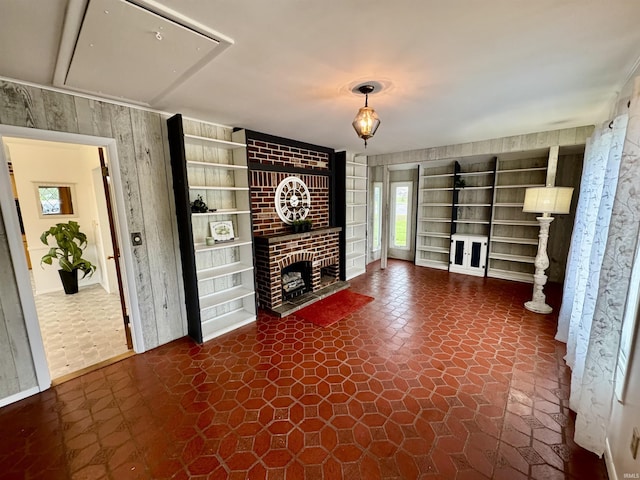 10908 Kathy Dr, Fort Wayne, IN 46835 - unfurnished living room with built in shelves and a brick fireplace