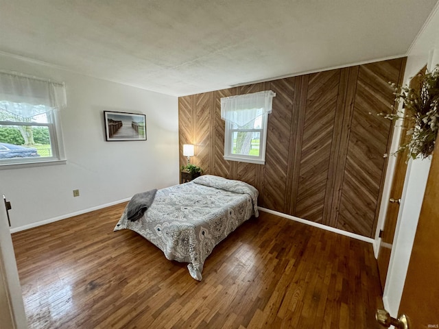 10908 Kathy Dr, Fort Wayne, IN 46835 - bedroom featuring wood finished floors, baseboards, and wooden walls
