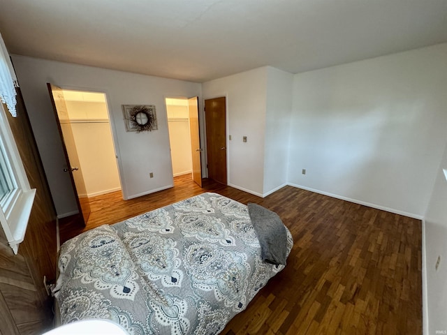 10908 Kathy Dr, Fort Wayne, IN 46835 - bedroom with wood finished floors, a spacious closet, baseboards, and a closet