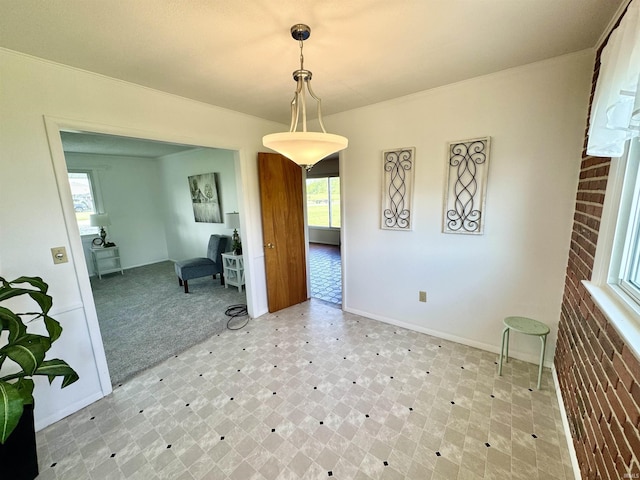 10908 Kathy Dr, Fort Wayne, IN 46835 - unfurnished dining area with tile patterned floors, plenty of natural light, and baseboards