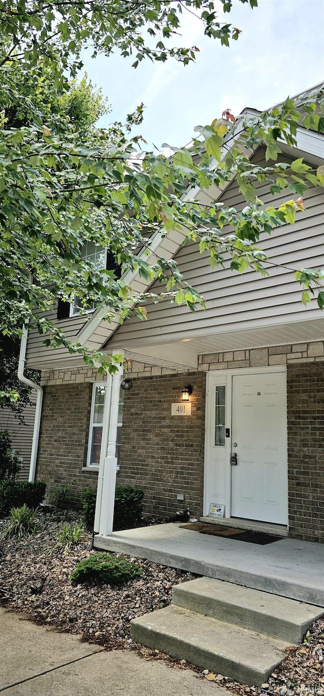1250 W Adams Hill Cir Unit 401, Bloomington, IN 47403 - entrance to property featuring brick siding