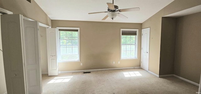 1250 W Adams Hill Cir Unit 401, Bloomington, IN 47403 - unfurnished bedroom featuring multiple windows, carpet, and baseboards