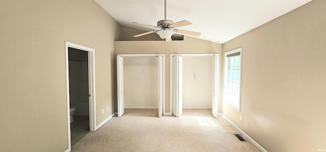 1250 W Adams Hill Cir Unit 401, Bloomington, IN 47403 - unfurnished bedroom featuring vaulted ceiling, light colored carpet, ensuite bathroom, baseboards, and ceiling fan