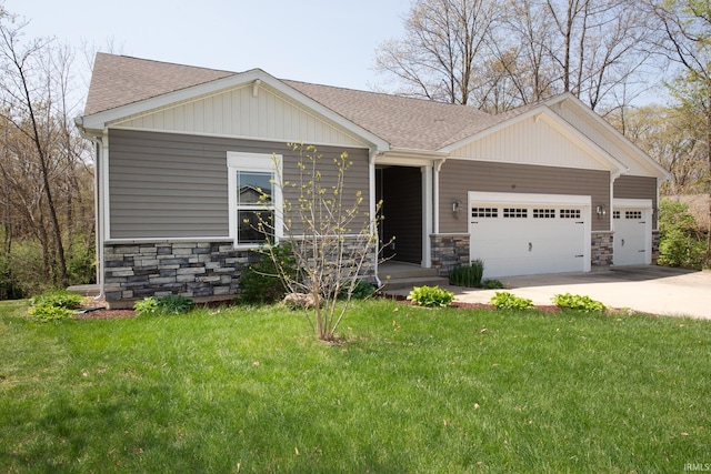 6336 Munsee Dr, West Lafayette, IN 47906 - view of front of home with stone siding, a shingled roof, and driveway