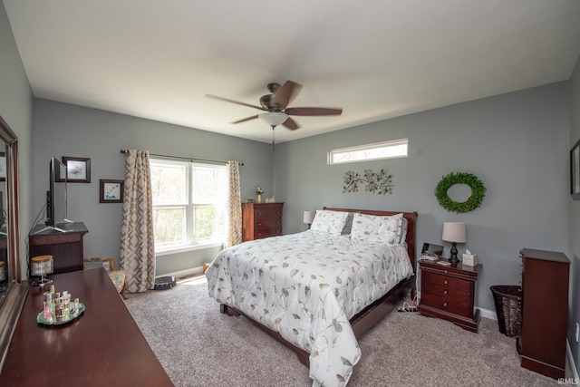 6336 Munsee Dr, West Lafayette, IN 47906 - carpeted bedroom with multiple windows, a ceiling fan, and baseboards