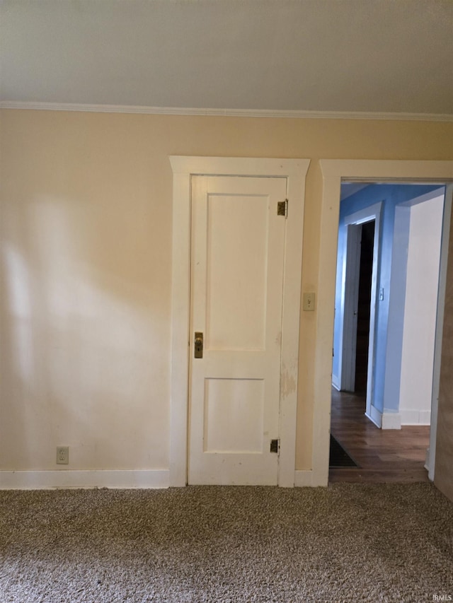 910 Ridgeway Ave, Vincennes, IN 47591 - spare room with carpet flooring, baseboards, ornamental molding, and wood finished floors