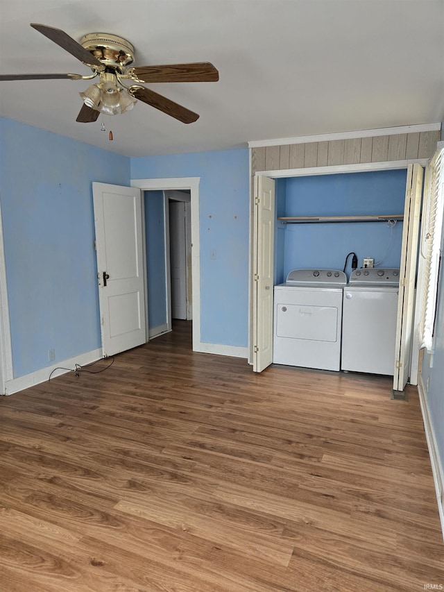 910 Ridgeway Ave, Vincennes, IN 47591 - unfurnished bedroom featuring baseboards, washing machine and dryer, wood finished floors, and a ceiling fan