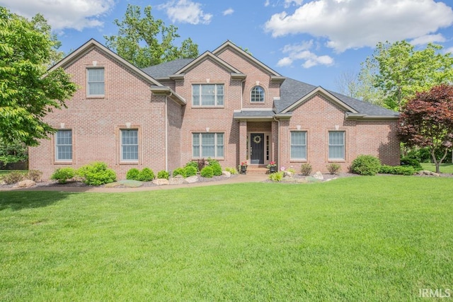 4288 Windhill Ln, Newburgh, IN 47630 - traditional-style house featuring brick siding and a front lawn