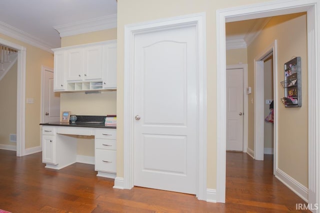 4288 Windhill Ln, Newburgh, IN 47630 - office space with built in study area, dark wood-style floors, crown molding, and baseboards