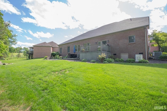 4288 Windhill Ln, Newburgh, IN 47630 - back of house with brick siding, cooling unit, and a lawn