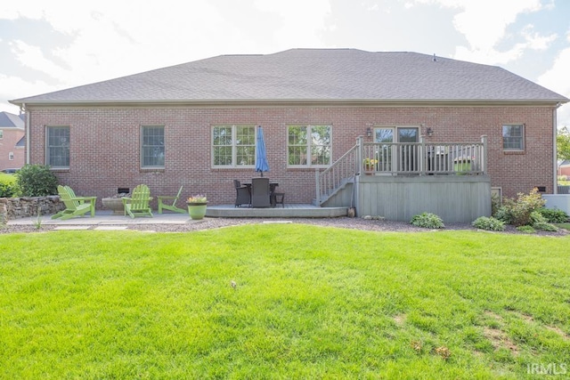 4288 Windhill Ln, Newburgh, IN 47630 - back of property with brick siding, a patio, and a lawn