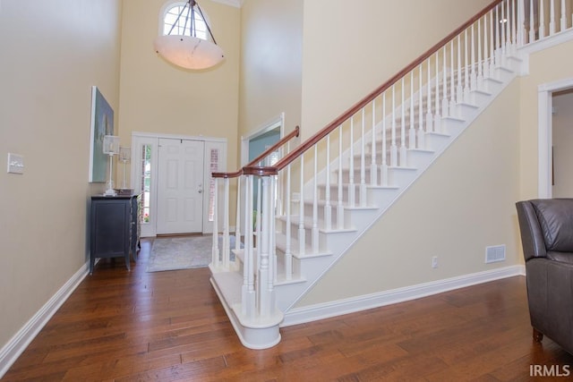 4288 Windhill Ln, Newburgh, IN 47630 - foyer entrance featuring hardwood / wood-style floors, a high ceiling, stairs, and baseboards