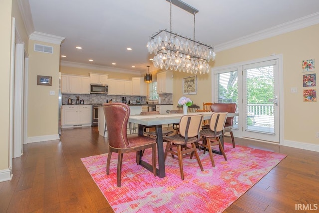 4288 Windhill Ln, Newburgh, IN 47630 - dining area featuring crown molding, a chandelier, dark wood-type flooring, baseboards, and recessed lighting