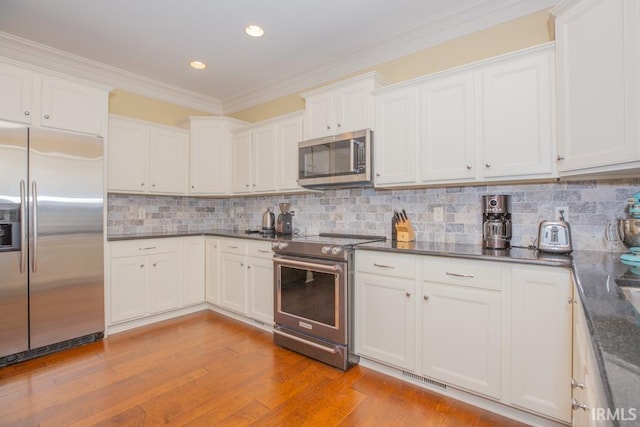 4288 Windhill Ln, Newburgh, IN 47630 - kitchen with appliances with stainless steel finishes, ornamental molding, recessed lighting, light wood-type flooring, and white cabinetry
