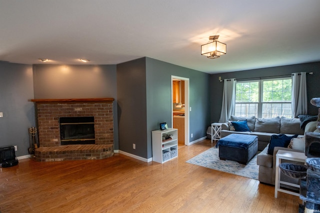 5212 E 600 S, Lafayette, IN 47909 - living room featuring light wood-style flooring, a fireplace, and baseboards