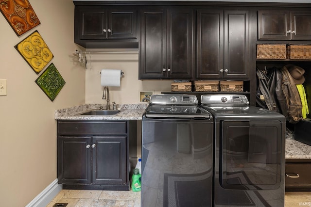 2525 Hastye Hyll, Logansport, IN 46947 - washroom featuring washing machine and dryer, baseboards, and cabinet space