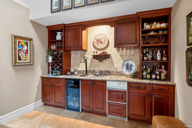 2525 Hastye Hyll, Logansport, IN 46947 - indoor wet bar featuring wine cooler, baseboards, and tasteful backsplash
