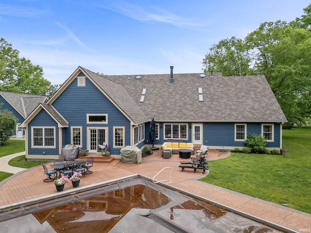 2525 Hastye Hyll, Logansport, IN 46947 - rear view of house with outdoor lounge area, a patio, a yard, and roof with shingles