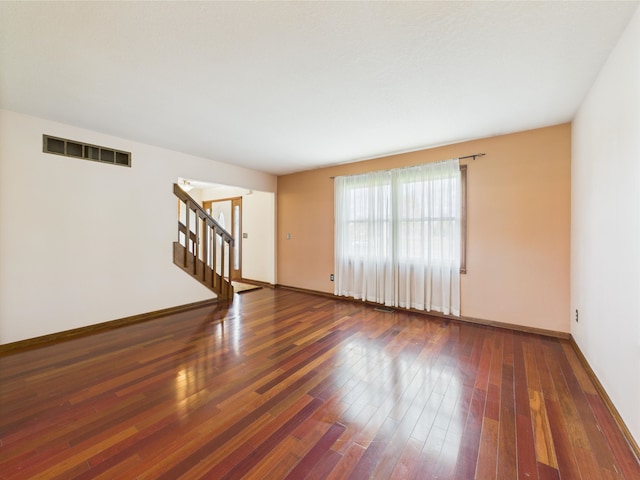 3715 W 630 Rd N, Huntington, IN 46750 - unfurnished room featuring stairs, wood finished floors, and baseboards