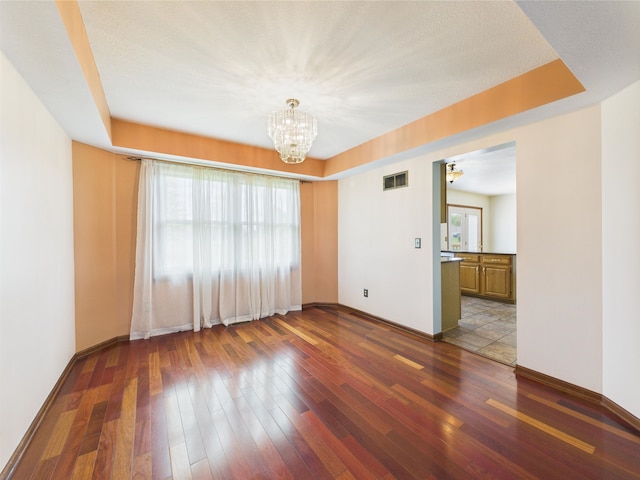 3715 W 630 Rd N, Huntington, IN 46750 - empty room with wood-type flooring, a chandelier, and baseboards