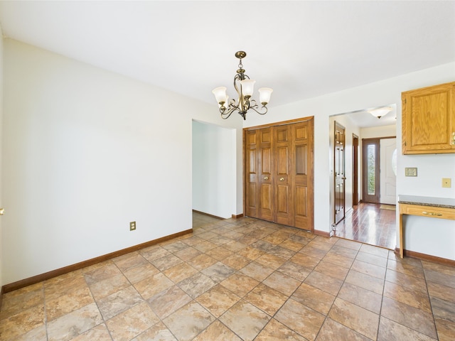3715 W 630 Rd N, Huntington, IN 46750 - unfurnished dining area featuring baseboards, a chandelier, and light stone finish flooring