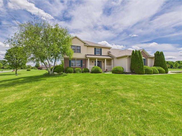 3715 W 630 Rd N, Huntington, IN 46750 - traditional-style home with a porch, a front yard, and brick siding