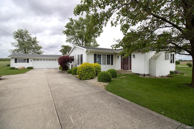 6497 N 500 E, Union City, IN 47390 - single story home featuring a front lawn, an outbuilding, concrete driveway, and an attached garage