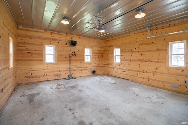 6497 N 500 E, Union City, IN 47390 - garage featuring wooden walls and a garage door opener