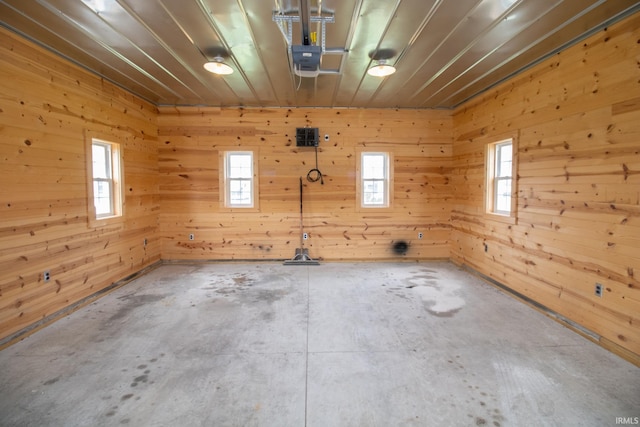 6497 N 500 E, Union City, IN 47390 - empty room with concrete floors, plenty of natural light, and wood walls