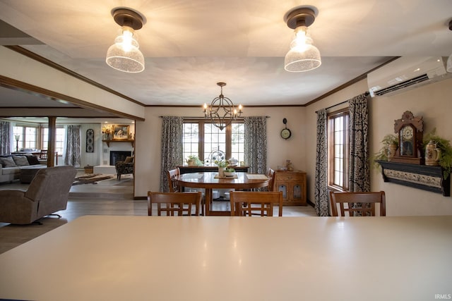 6497 N 500 E, Union City, IN 47390 - dining area with a wall mounted AC, plenty of natural light, a glass covered fireplace, ornamental molding, and wood finished floors